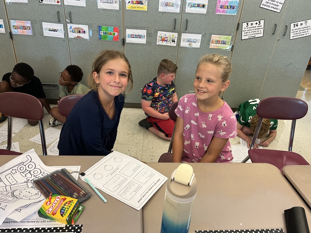Fifth and Second Graders smiling