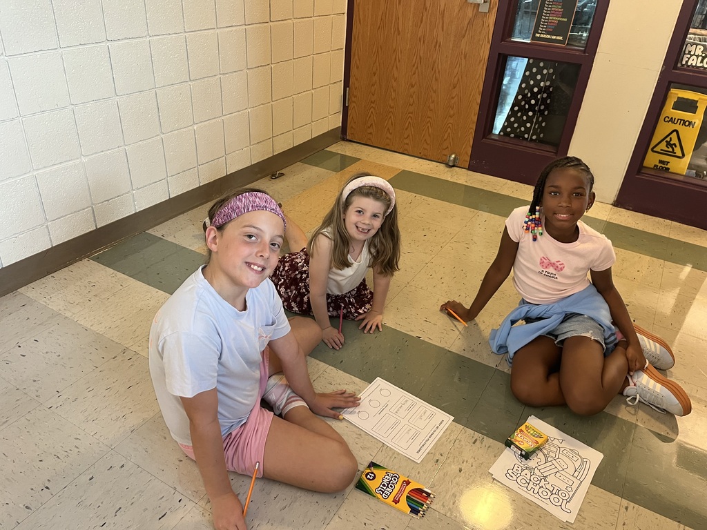 Fifth and Second Graders smiling