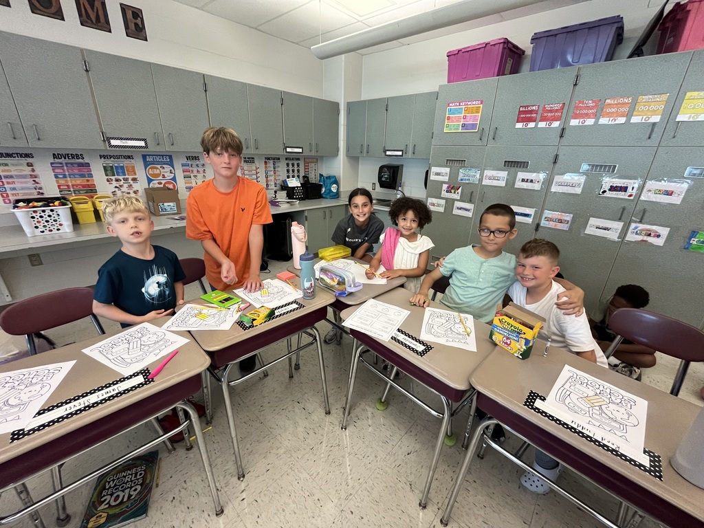 Fifth and Second Graders smiling