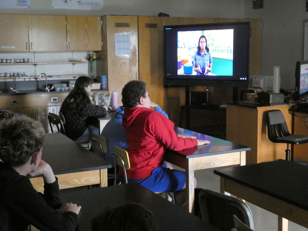 Students at AMS watch a Start with Hello video in class