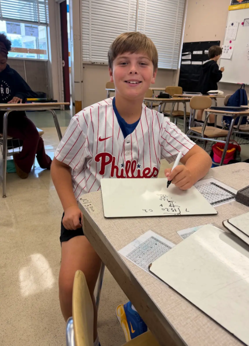 Image of Stingray 6th grade students school spirit event wearing phillies gear. 