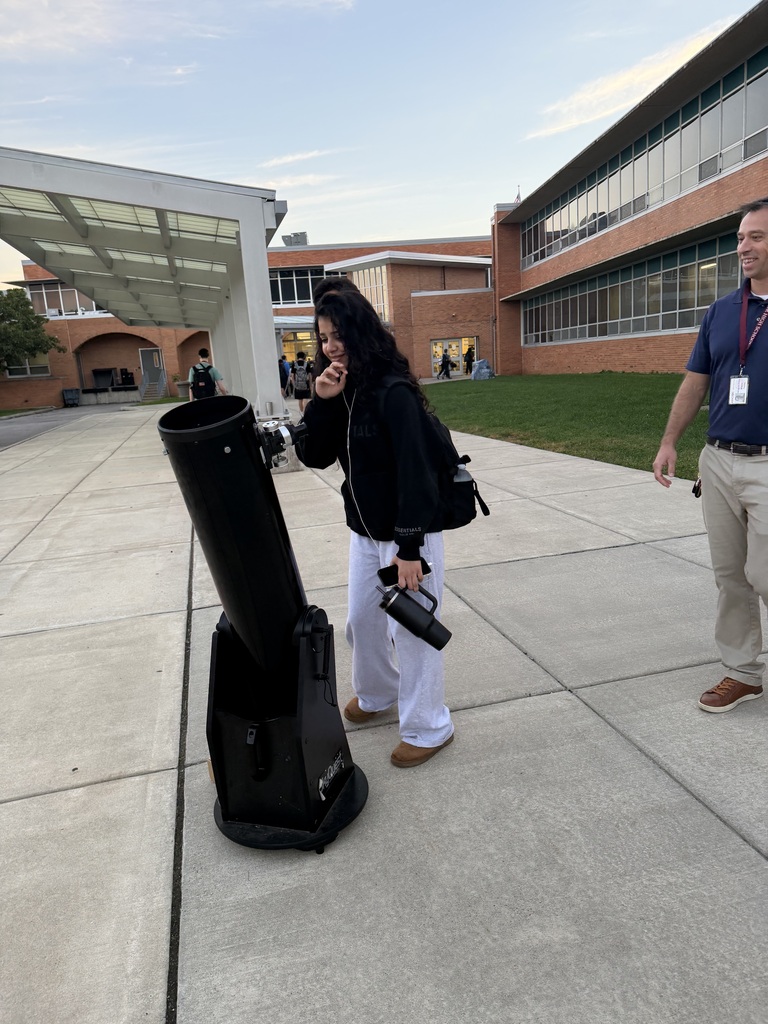 student approaching the telescope