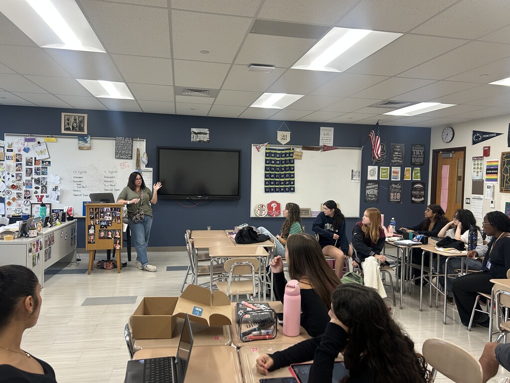 Hutton interacting with students