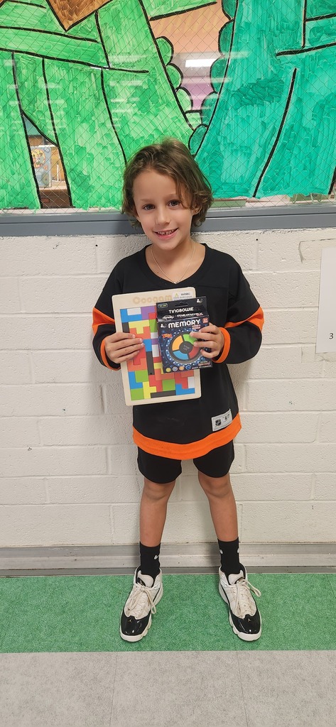 Student holding puzzle games.