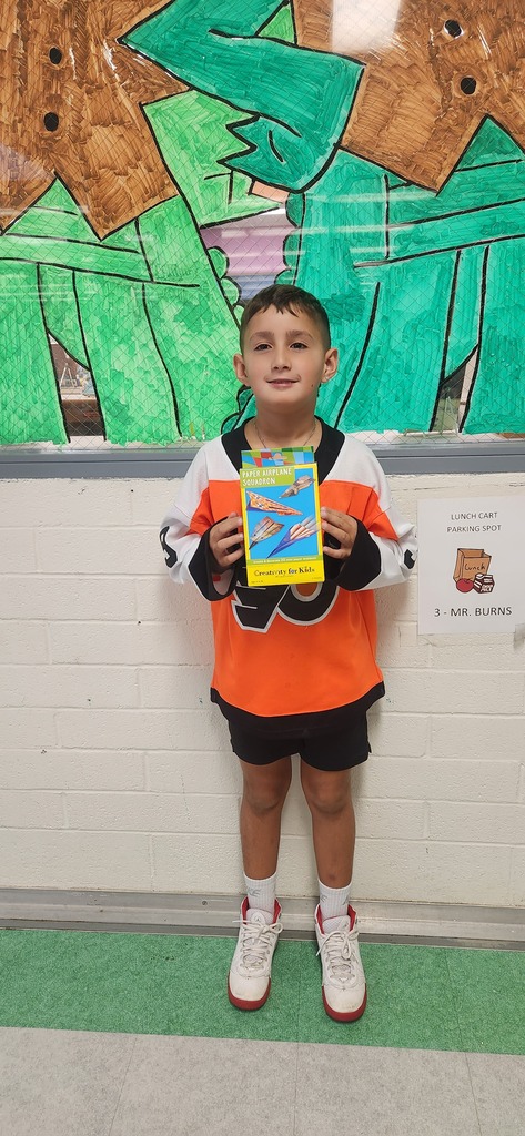 Student holding a game box.