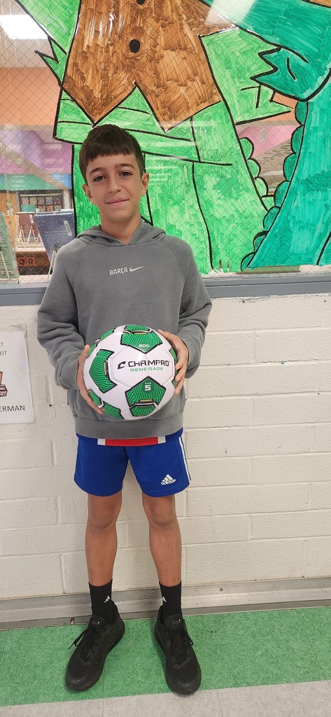 Student holding a soccer ball