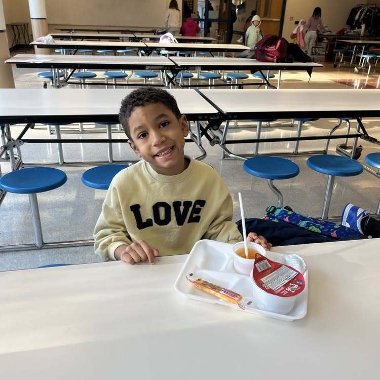 Willow Hill student eating breakfast in the cafeteria