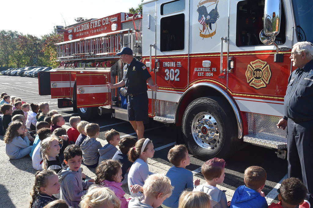 Copper Beech kindergarteners listen as Weldon volunteer firefighters describe the tools on their fire truck