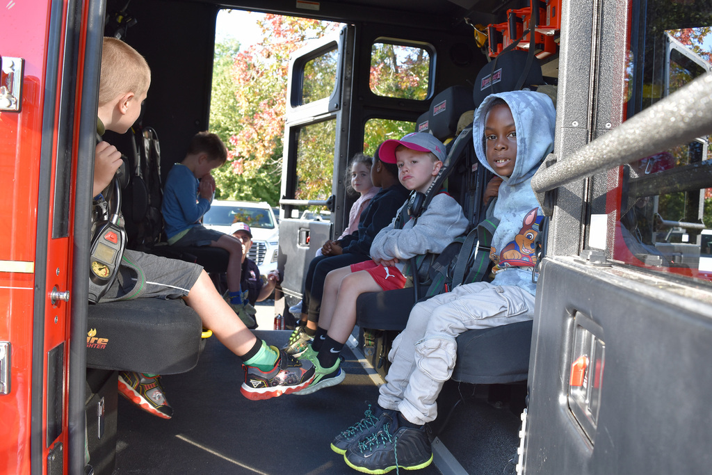 Copper Beech kindergarten students sit inside the fire truck