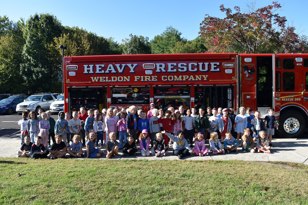 Copper Beech kindergarten classes pose in front of the Weldon Heavy Rescue Fire Truck