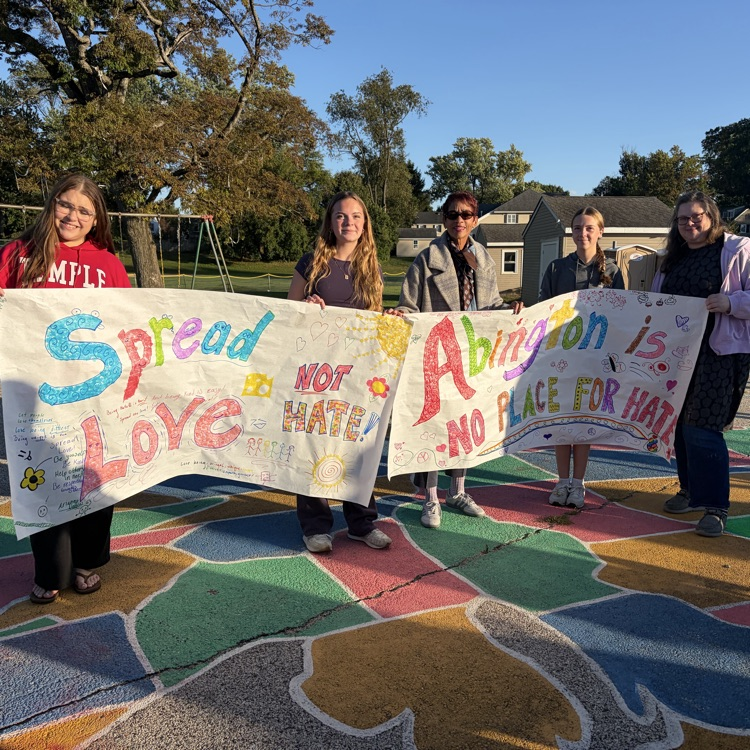 High school students hold an Abington No Place for Hate homemade banner