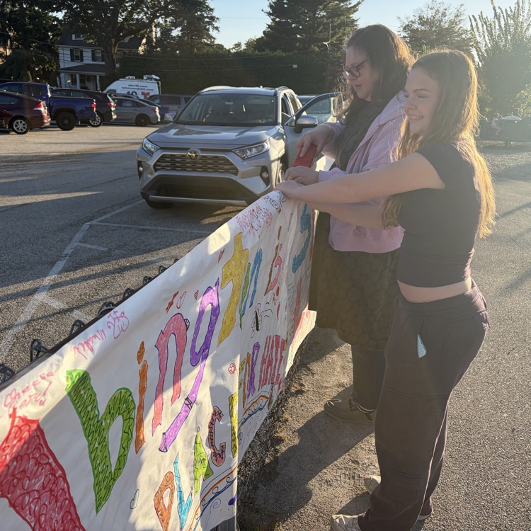High school students hold an Abington No Place for Hate homemade banner