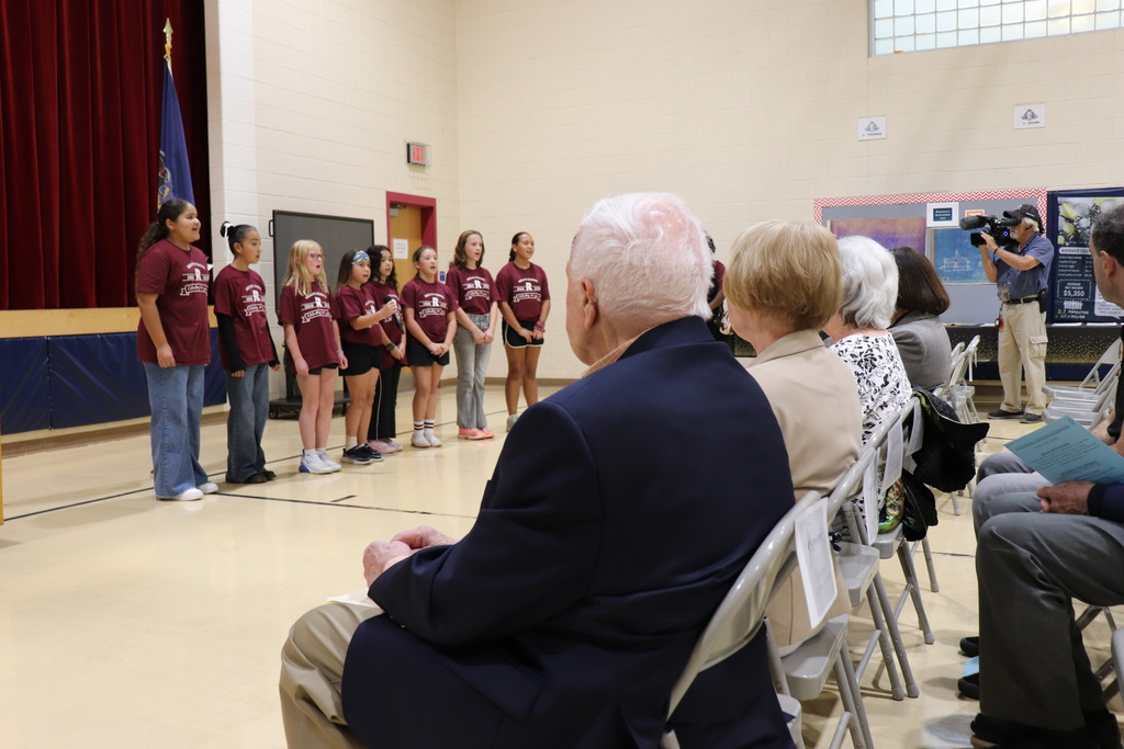 Students start the program by performing for the audience