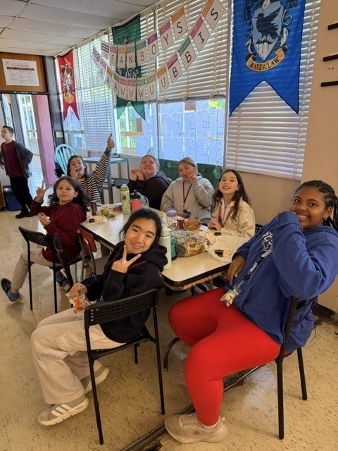 Image of homework club students celebrating. 