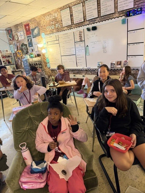 Image of homework club students celebrating. 