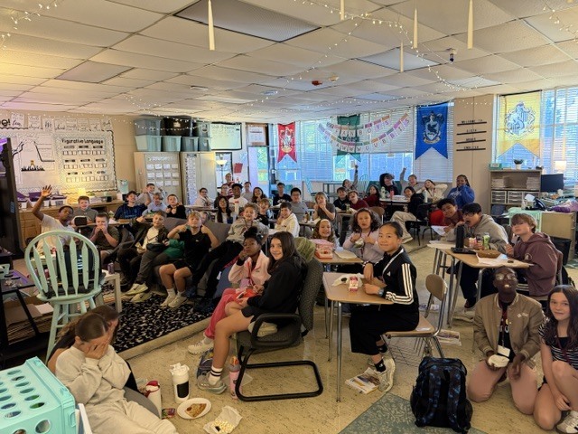 Image of homework club students celebrating. 