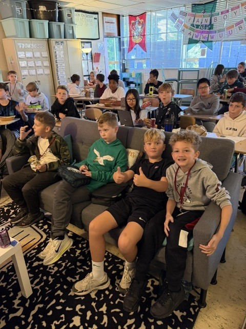 Image of homework club students celebrating. 