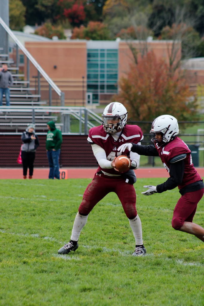 football player passing the ball at the game