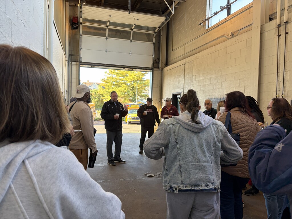 Dr. Fecher meets with Transportation Staff in the Wash Bay