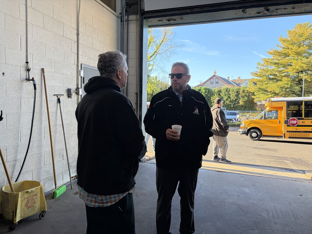 Dr. Fecher meets with Transportation Staff in the Wash Bay