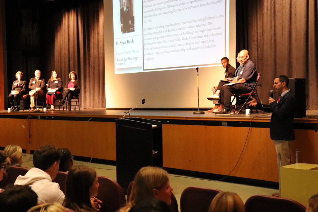 Mr. Berger fields questions from students for the panelists