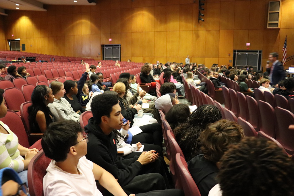 Mr. Berger fields questions from students for the panelists
