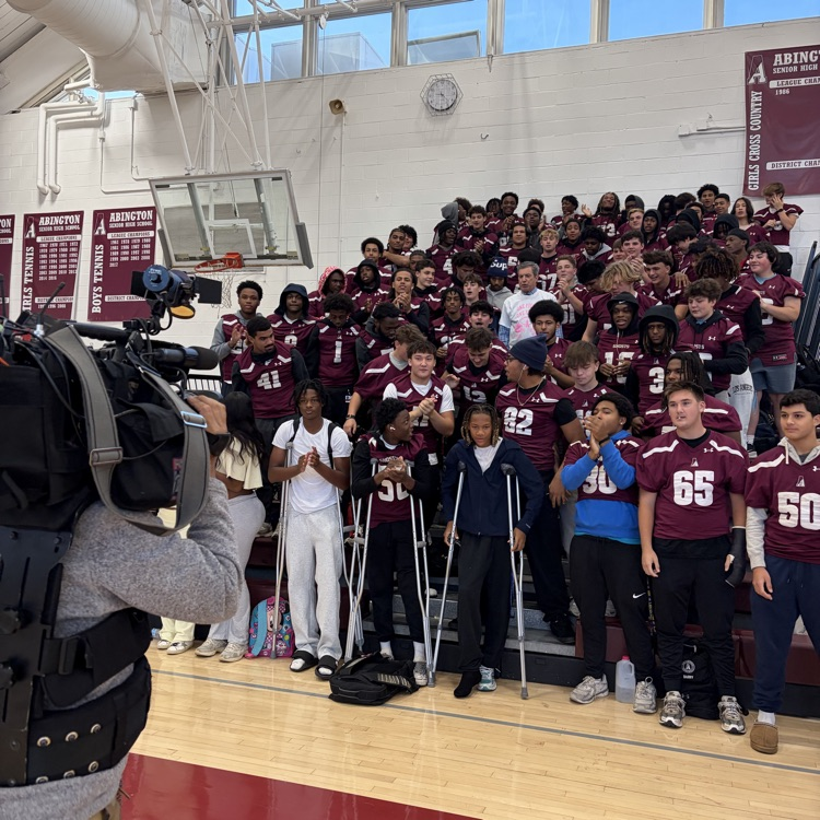 Bob Kelly interviews the football team for a live segment