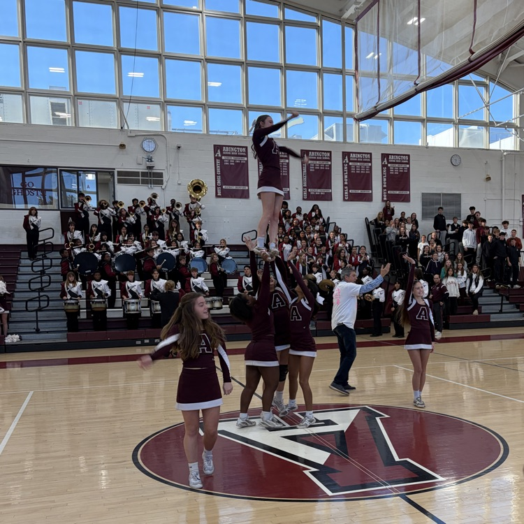 Cheerleaders do stunts on air