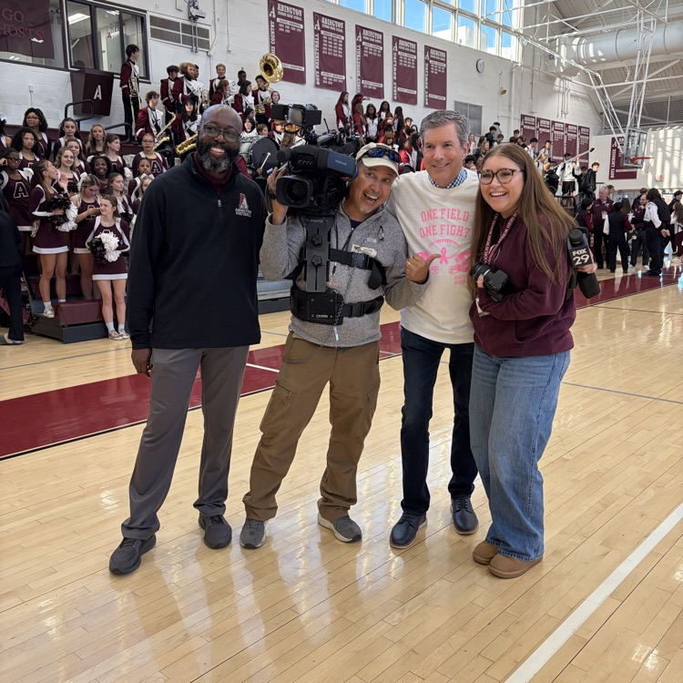 Students and staff pose with Bob Kelly
