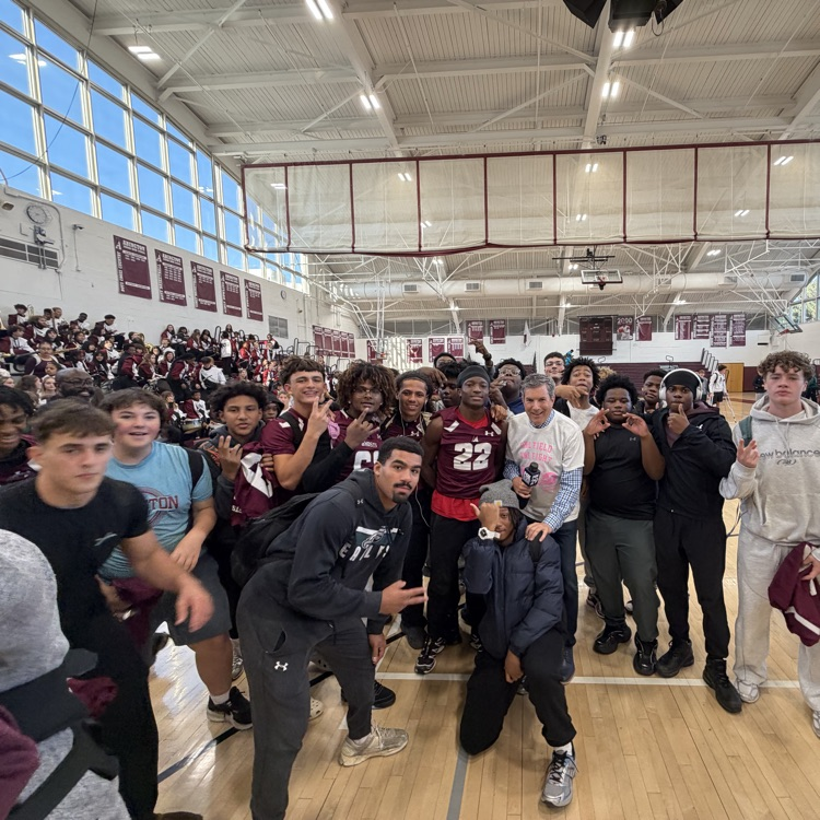 Students and staff pose with Bob Kelly