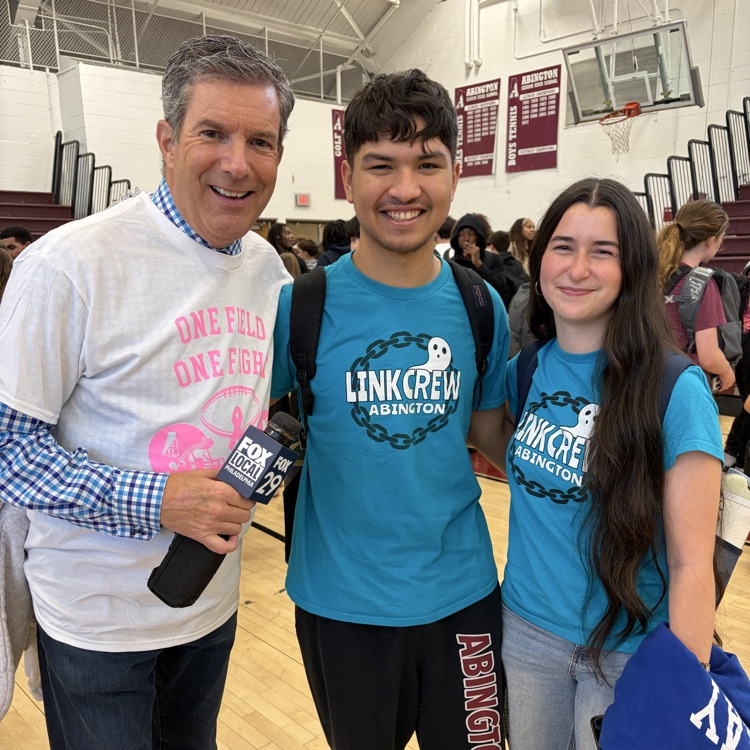 Students and staff pose with Bob Kelly