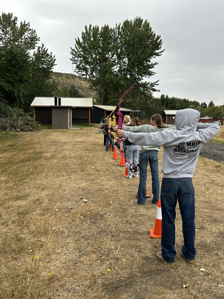 students shooting archery