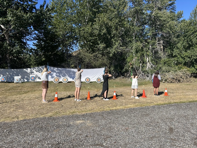 students shooting archery