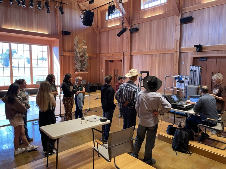 students listen to musicians