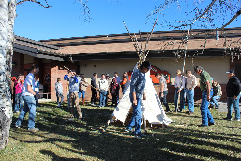 Building a traditional Crow teepee