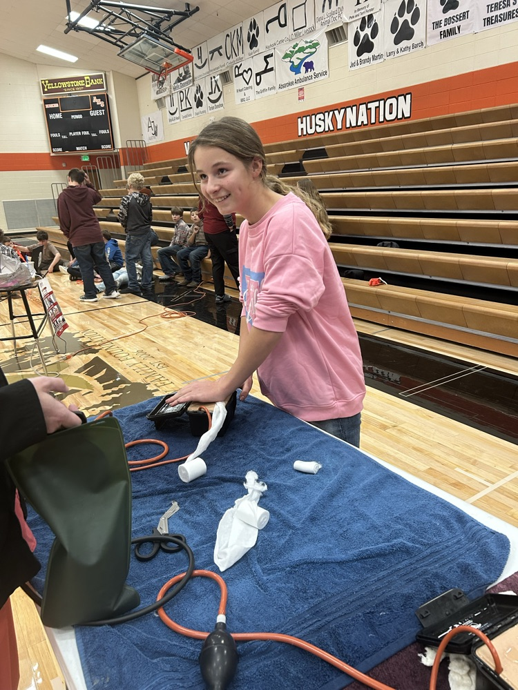 student packing a wound