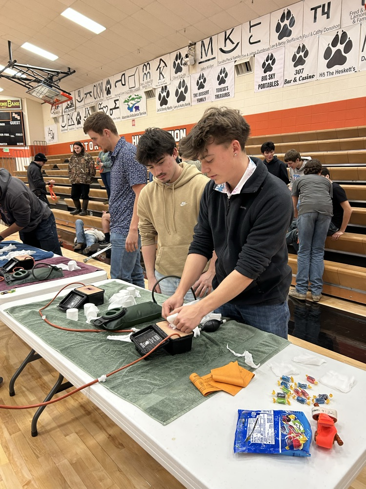 student packing a wound