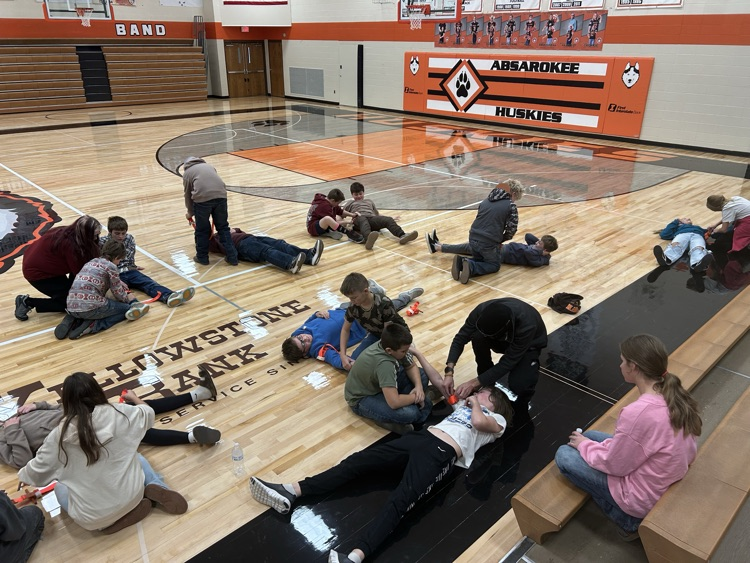 group of students learning about tourniquets 