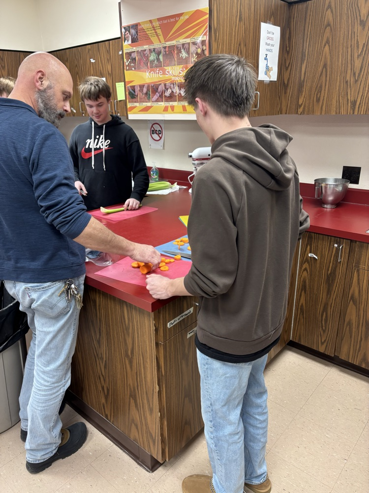 boys chopping veggies
