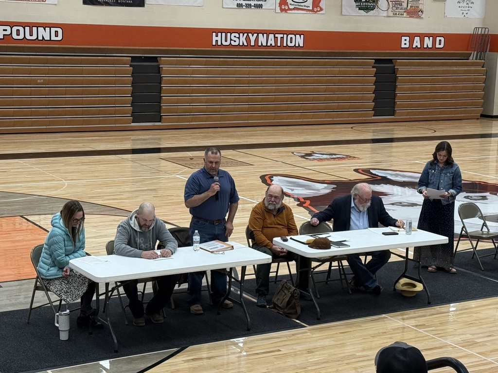 School board candidates sitting at a table.