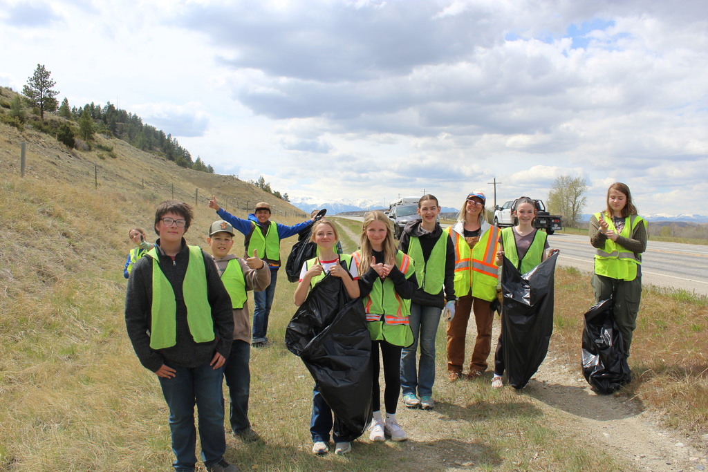 Picture of kids cleaning up town