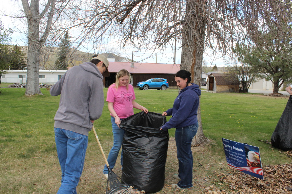 Picture of kids cleaning up town