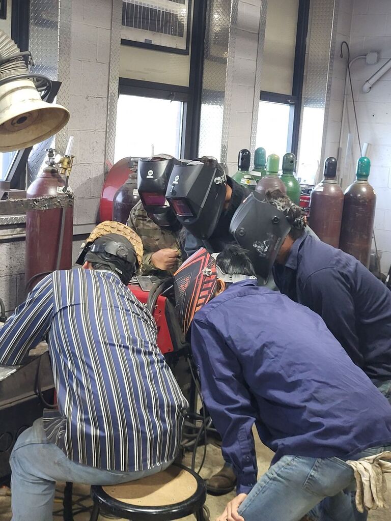 ACE Academy welding students work alongside students from Hawaii.