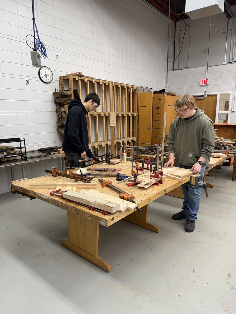 Two Student Making charcuterie boards.