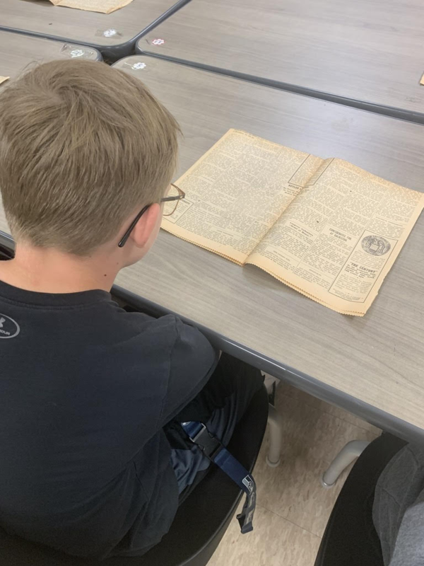 student reading newspaper
