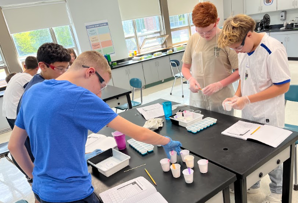 Hands-on learning in action, Acushnet 8th graders actively applying their knowledge, collaborating, and thinking critically to solve real-world challenges.