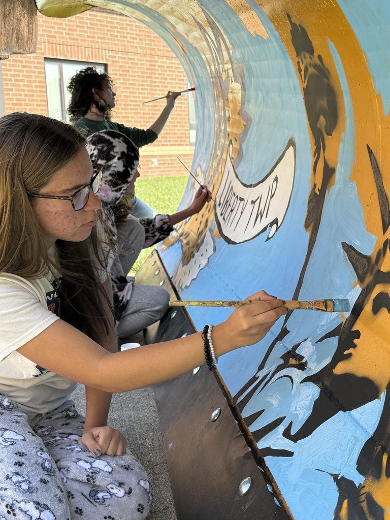 High School Art Students painting the Liberty Township plow