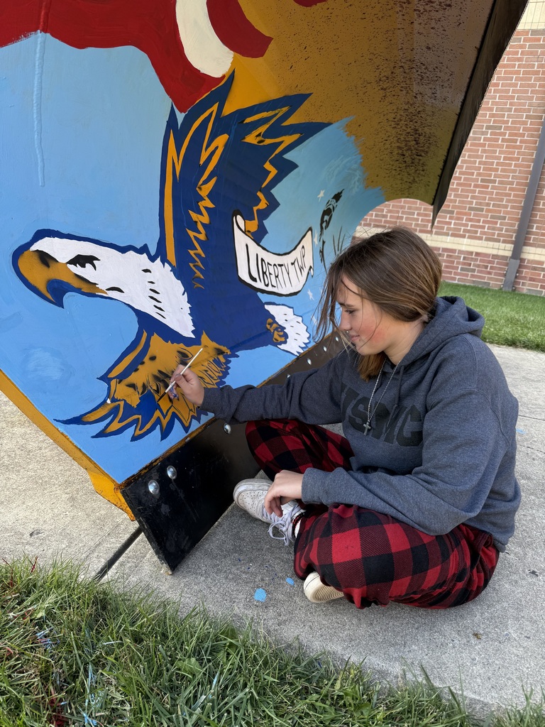 High School Art Students painting the Liberty Township plow