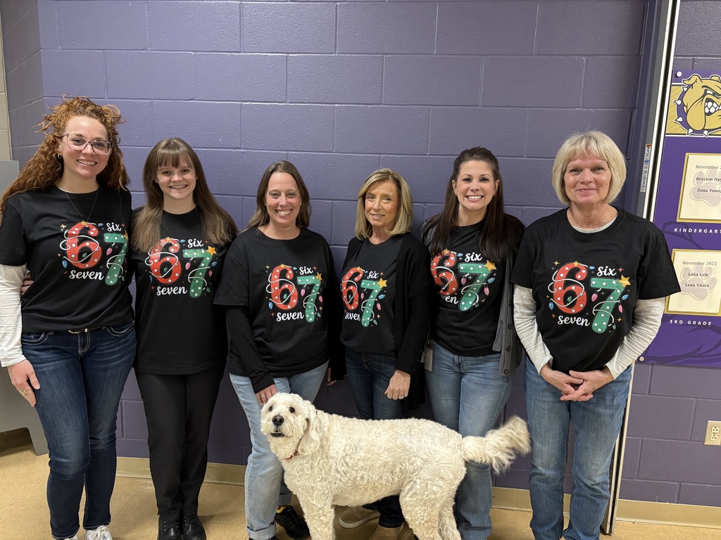 Office staff in festive 6-7 christmas shirts