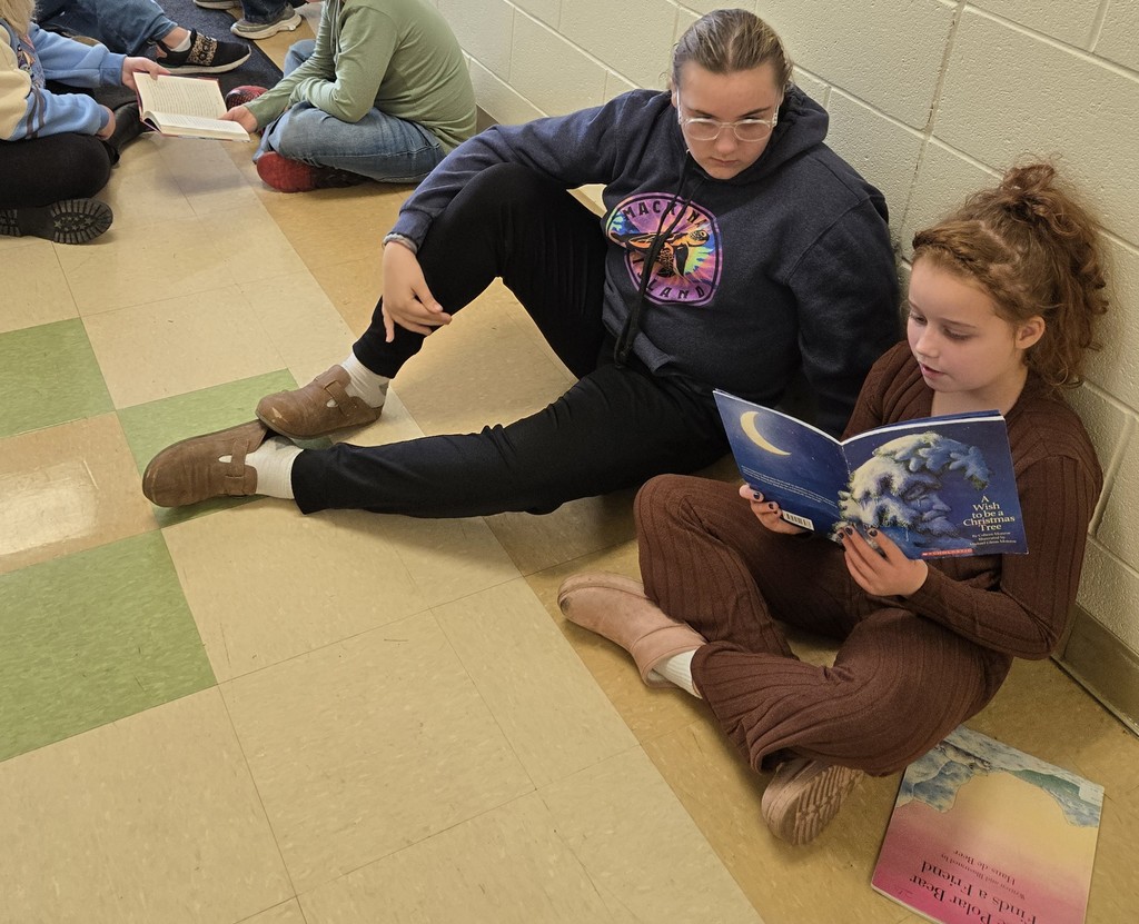 5th grader reading to 2nd grader